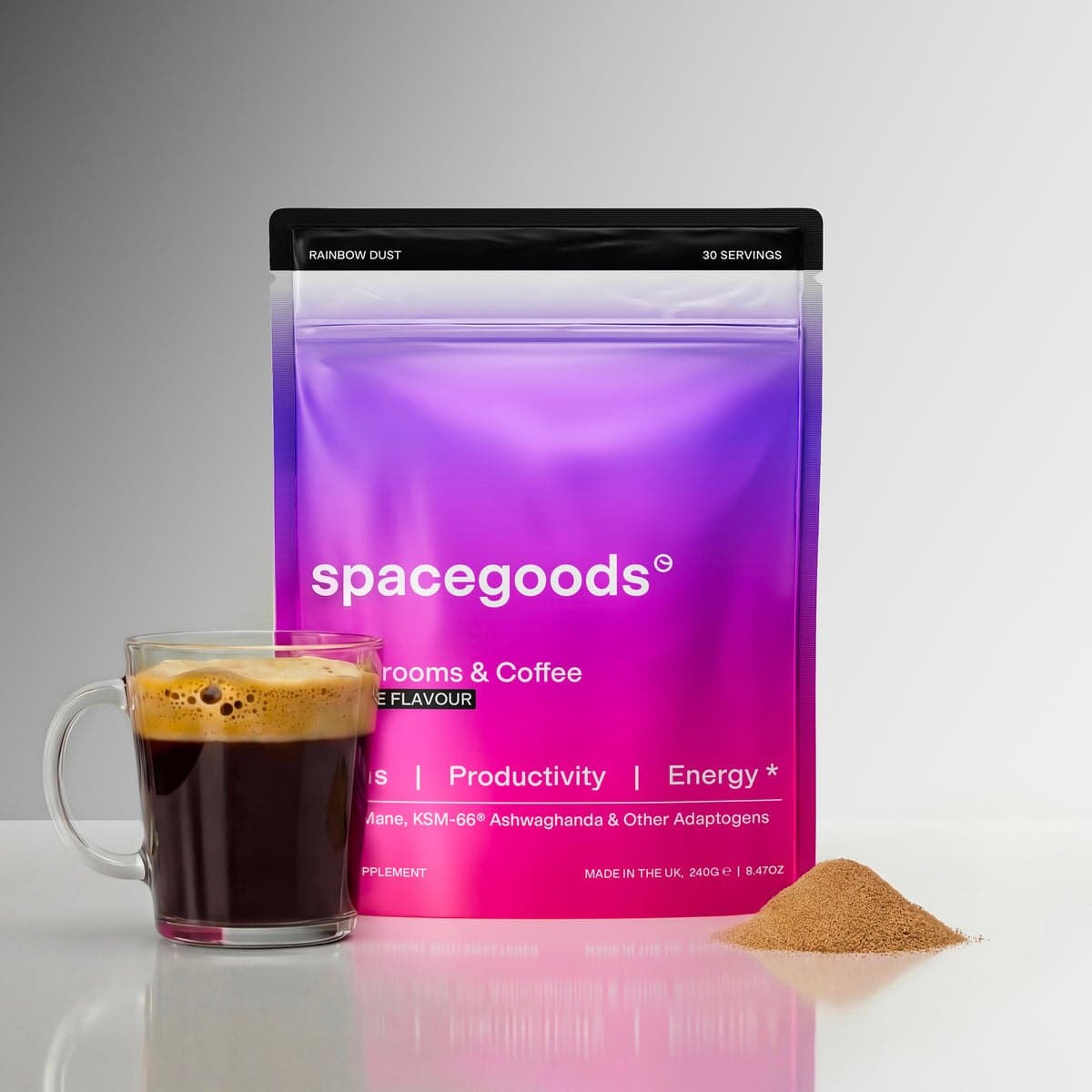 Spacegoods Rainbow Dust mushroom coffee pouch next to a mug