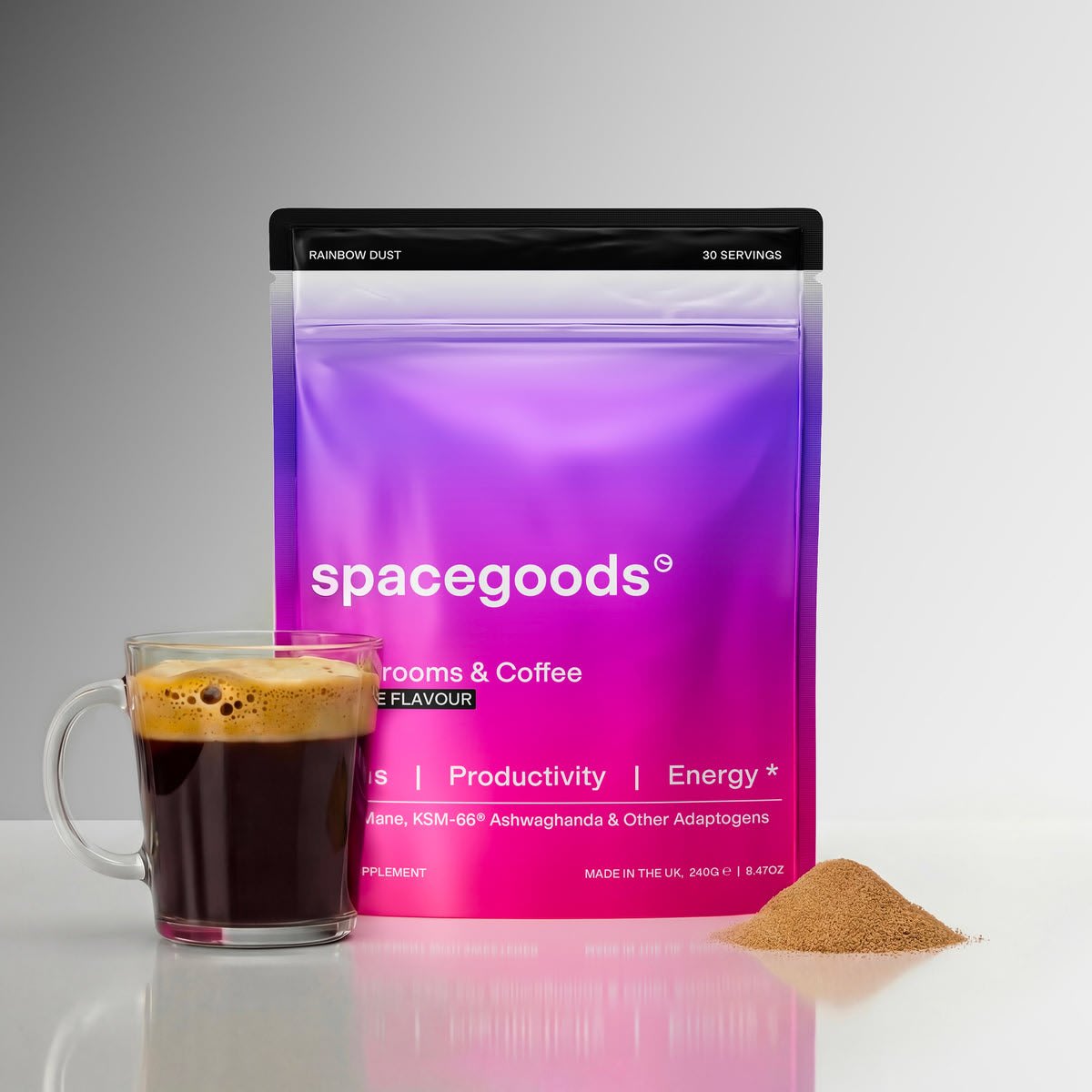 Spacegoods Rainbow Dust mushroom coffee pouch next to a mug