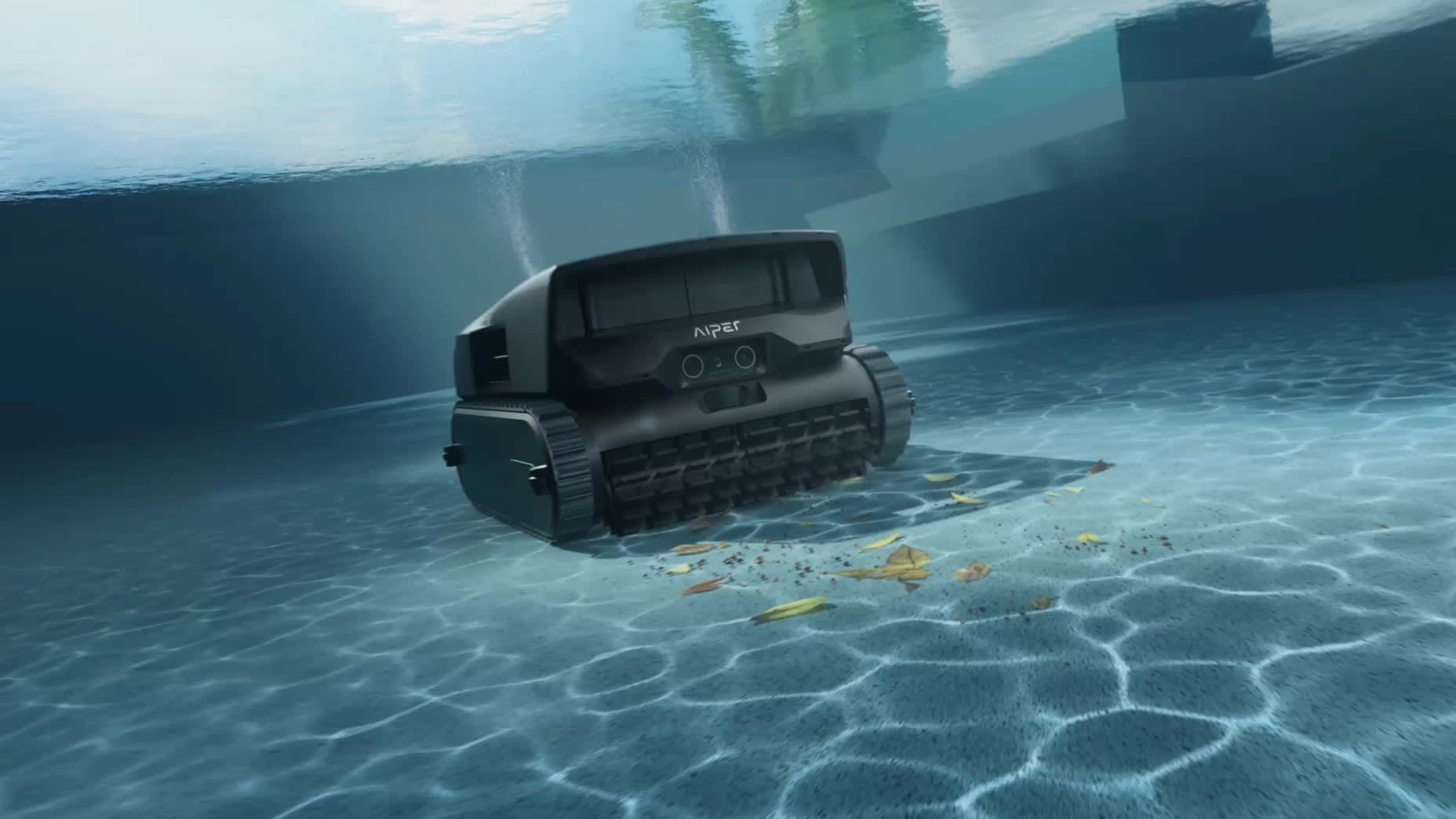 Aiper cordless robotic pool cleaner on the floor of an empty pool